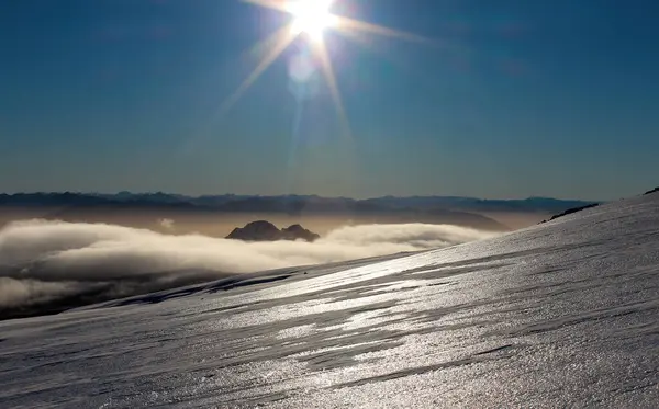 Top of Villarrica Volcano, landscape with sun reflecting on the ice of the mountainside