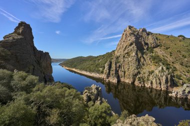 Rocky landscape in the Tajo Valley in Montfrge Nationalpark in Exremadura, Spain clipart