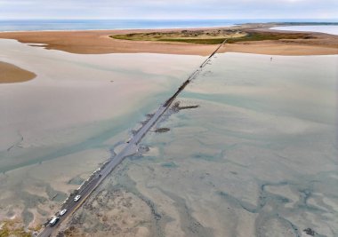 Flooded causeway to Lindisfarne on Holy Island, Northumbria, England, UK