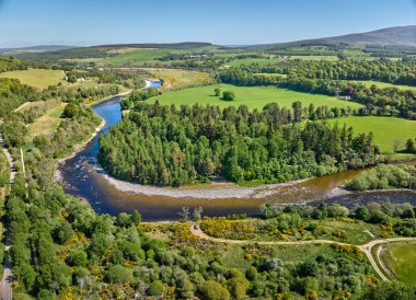 aerial view of the forest and pasture landscape at Spey River in eastern Scotland, UK