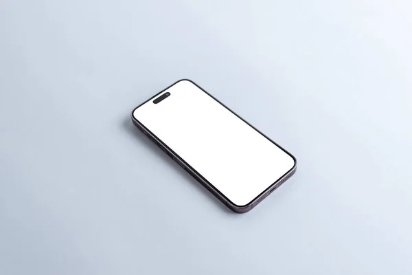 アプリやWebページのプレゼンテーションのための灰色のテーブルの上に空白の白いディスプレイ画面を持つスマートフォン — ストック写真