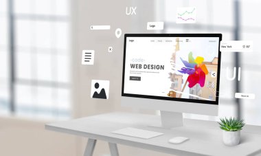 Web tasarım stüdyo sayfası içeren bir çalışma masasında bilgisayar ekranı. Yüzen web sitesi oluşturma modülleri, reklam metni için boş alan ile çevrili. Dijital tasarım göstermek için ideal.