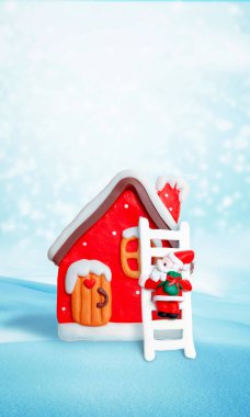 Charming red house with Santa climbing the chimney, set against a snowy background, creating a whimsical and festive holiday scene clipart