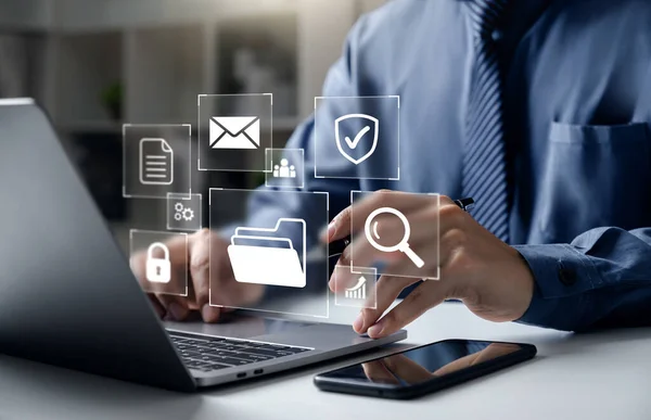 Document Management System DMS, Businessman pointing to folder and document, system used to create, store, manage, and track electronic document.