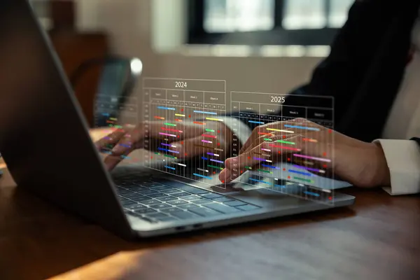 stock image Project manager working with Gantt chart schedule to Annual schedule update, Management diagram with planning software on laptop screen.