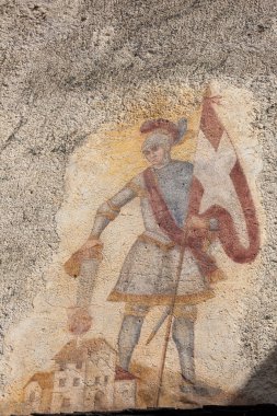 VILLANDRO, ITALY - SEPTEMBER 04, 2020: the recently restored historical paintings of St. Floriano (protector from fires) on the external walls long the way of the center of the little mountain town clipart