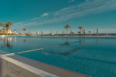 Empty hotel pool in the travel resort on the Red Sea in Hurghada clipart