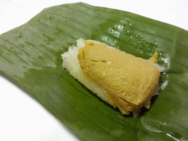 Thai dessert on banana leaf packing.  Sweet Sticky Rice with Thai Custard.