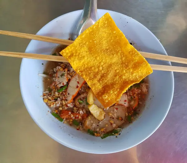 asian food and noodles with pork, vegetables, rice noodles, thai noodles.