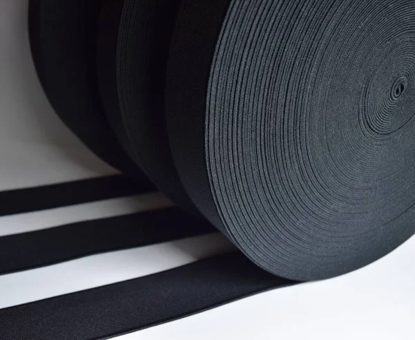 Elastic band isolated. Black elastic spool, the elastic band is made of polyester fibre.