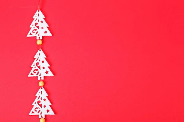Christmas garland on a red background close-up