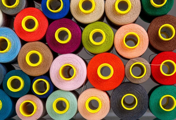 stock image set of multi-colored spools of thread for sewing close-up