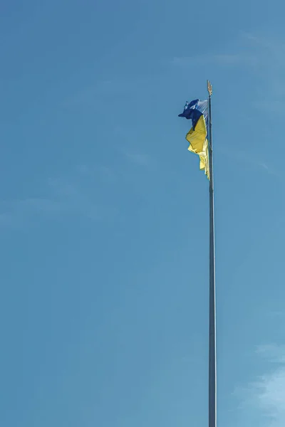 stock image Ukrainian flag against the blue sky close-up