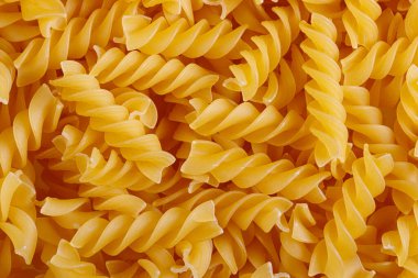 Pasta products in the form of a spiral, texture, close-up