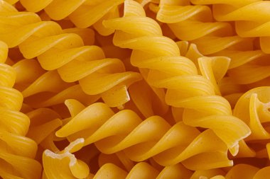 Pasta products in the form of a spiral, texture, close-up