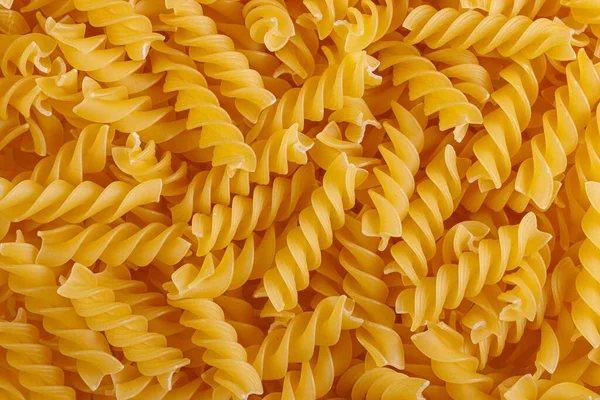 Pasta products in the form of a spiral, texture, close-up