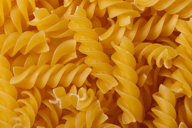 Pasta products in the form of a spiral, texture, close-up
