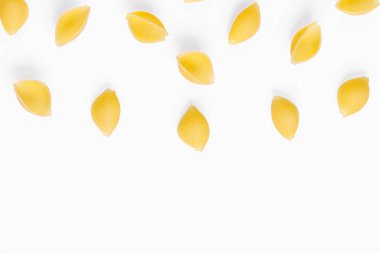 Pasta products in the form of a shell, texture, on a white background close-up