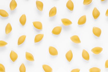 Pasta products in the form of a shell, texture, on a white background close-up