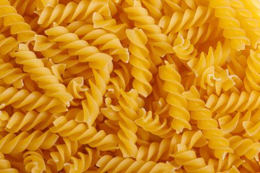 Pasta products in the form of a spiral, texture, close-up