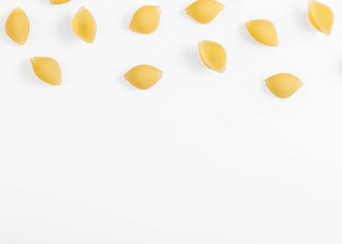 Pasta products in the form of a shell, texture, on a white background close-up