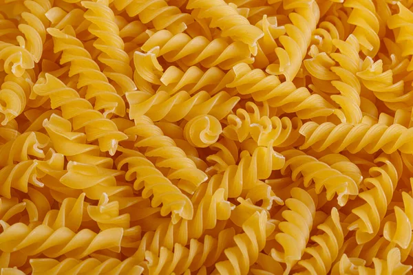 Pasta products in the form of a spiral, texture, close-up