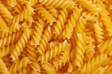 Pasta products in the form of a spiral, texture, close-up