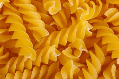 Pasta products in the form of a spiral, texture, close-up
