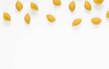 Pasta products in the form of a shell, texture, on a white background close-up