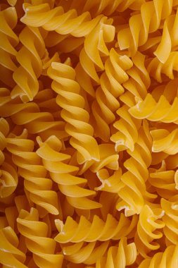 Pasta products in the form of a spiral, texture, close-up