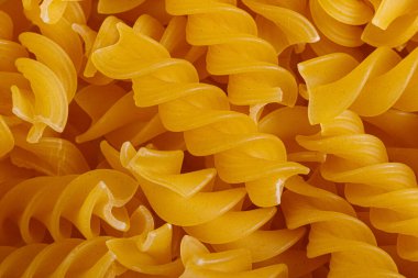 Pasta products in the form of a spiral, texture, close-up