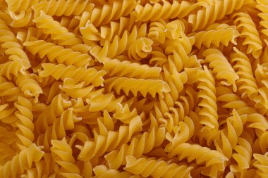Pasta products in the form of a spiral, texture, close-up