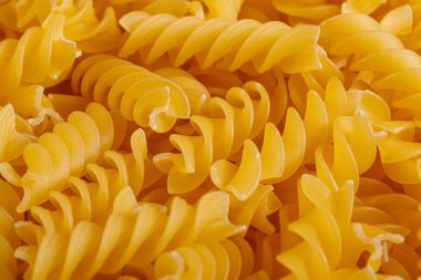 Pasta products in the form of a spiral, texture, close-up