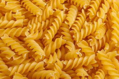 Pasta products in the form of a spiral, texture, close-up