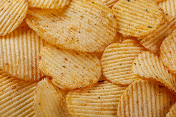 Lots of potato chips, texture close up