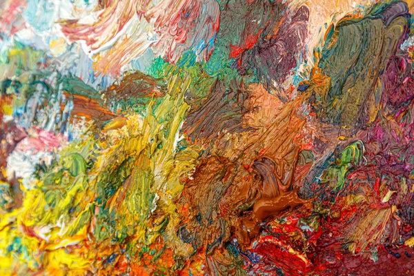 painting palette with different colors of paint close-up