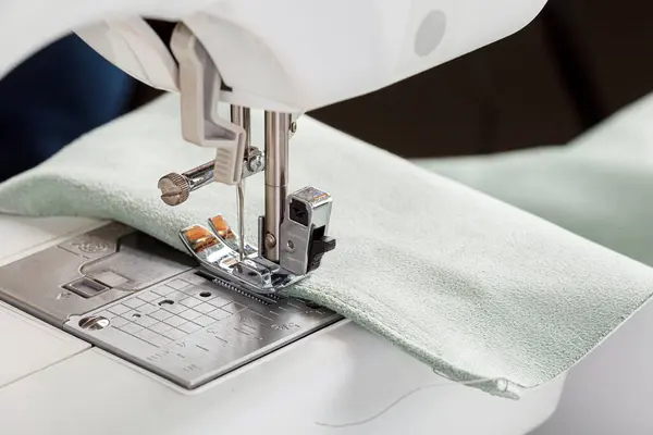 stock image Sewing machine, stitching fabrics, needle in a round plan close up