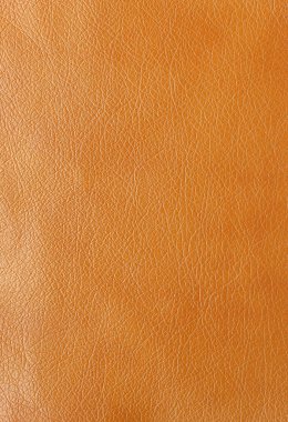 Orijinal deri dokusu, yapay deri kaplama turuncu arka plan.