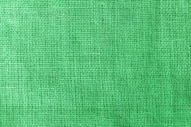 texture fabric burlap for sewing green background color macro close-up