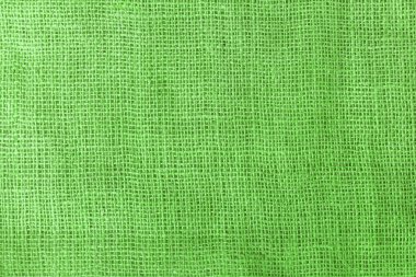 texture fabric burlap for sewing green background color macro close-up