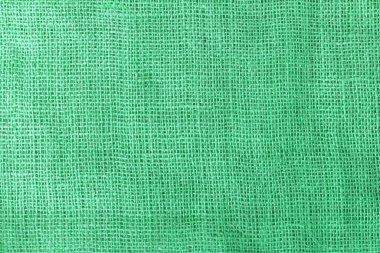 texture fabric burlap for sewing green background color macro close-up