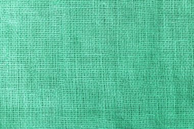 texture fabric burlap for sewing green background color macro close-up