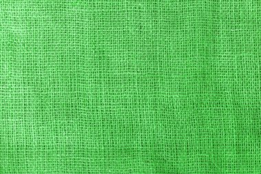 texture fabric burlap for sewing green background color macro close-up