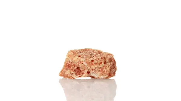 stock image Halite mineral stone spinning in a circle on a white background close-up