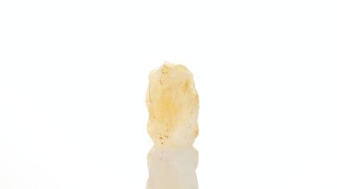 mineral stone citrine rotates in a circle on a white background close-up clipart