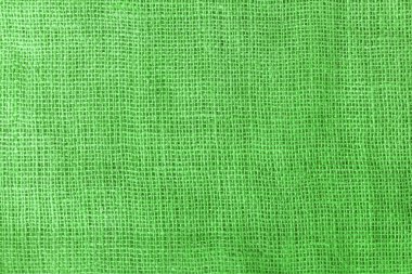 texture fabric burlap for sewing green background color macro close-up