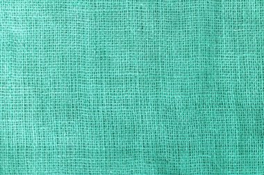 texture fabric burlap for sewing green background color macro close-up