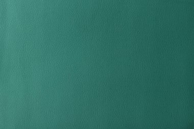 Gerçek deri dokusu, yapay deri kaplama yeşil arka plan.