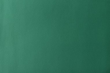 Gerçek deri dokusu, yapay deri kaplama yeşil arka plan.