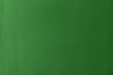 Gerçek deri dokusu, yapay deri kaplama yeşil arka plan.